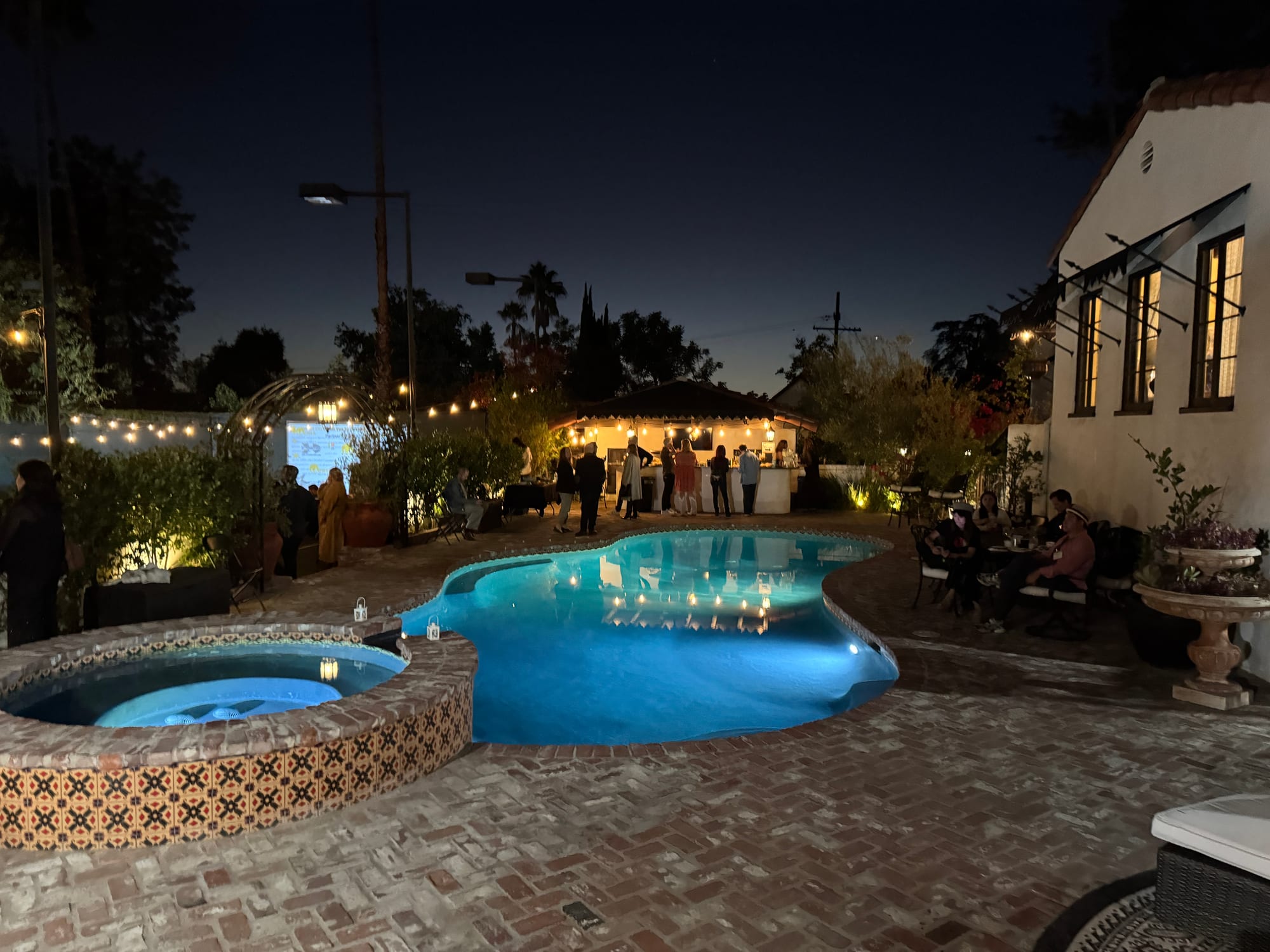 The illuminated pool and spa at night during the fundraiser