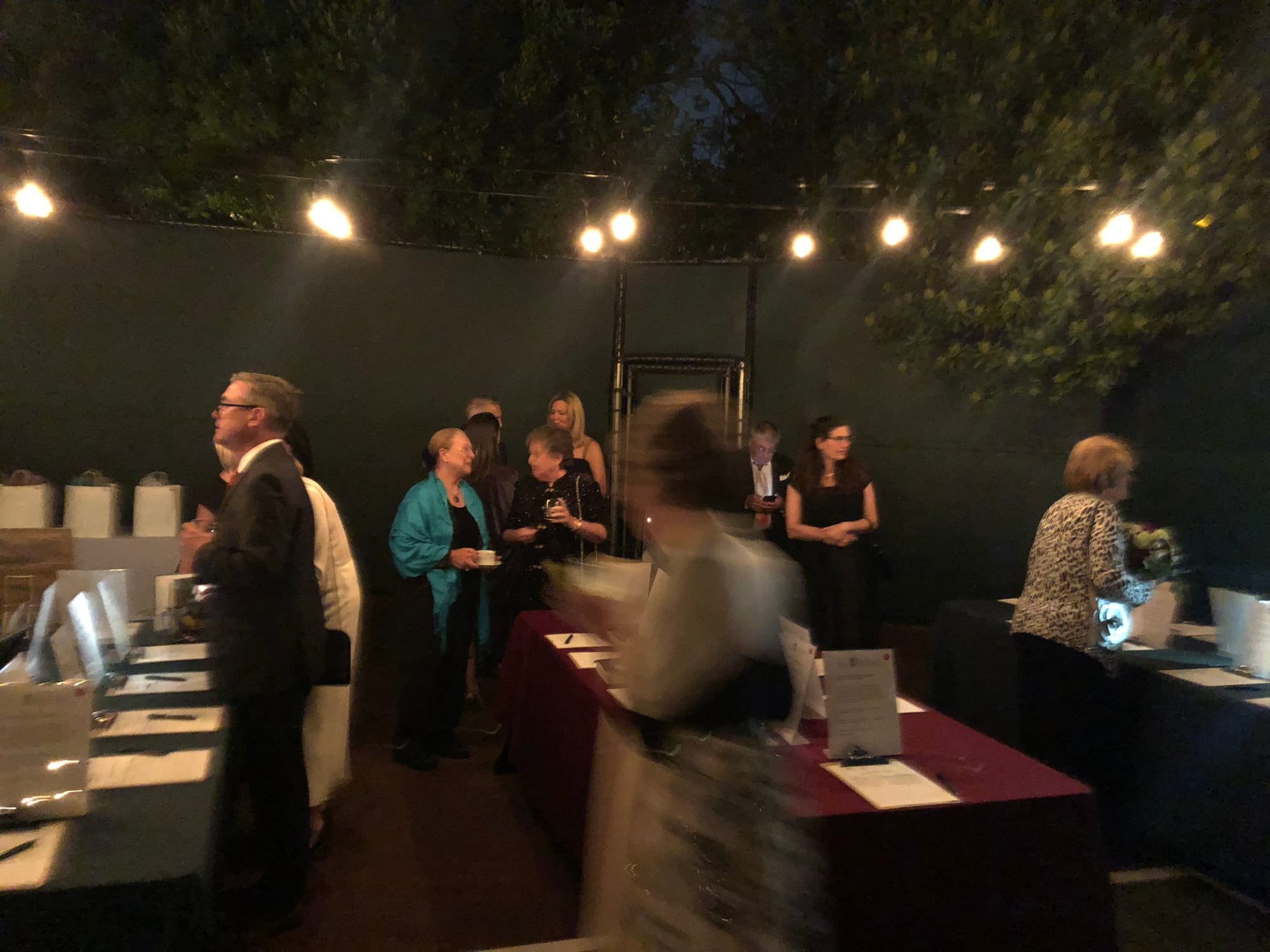 Guests at the welcome table during the evening reception