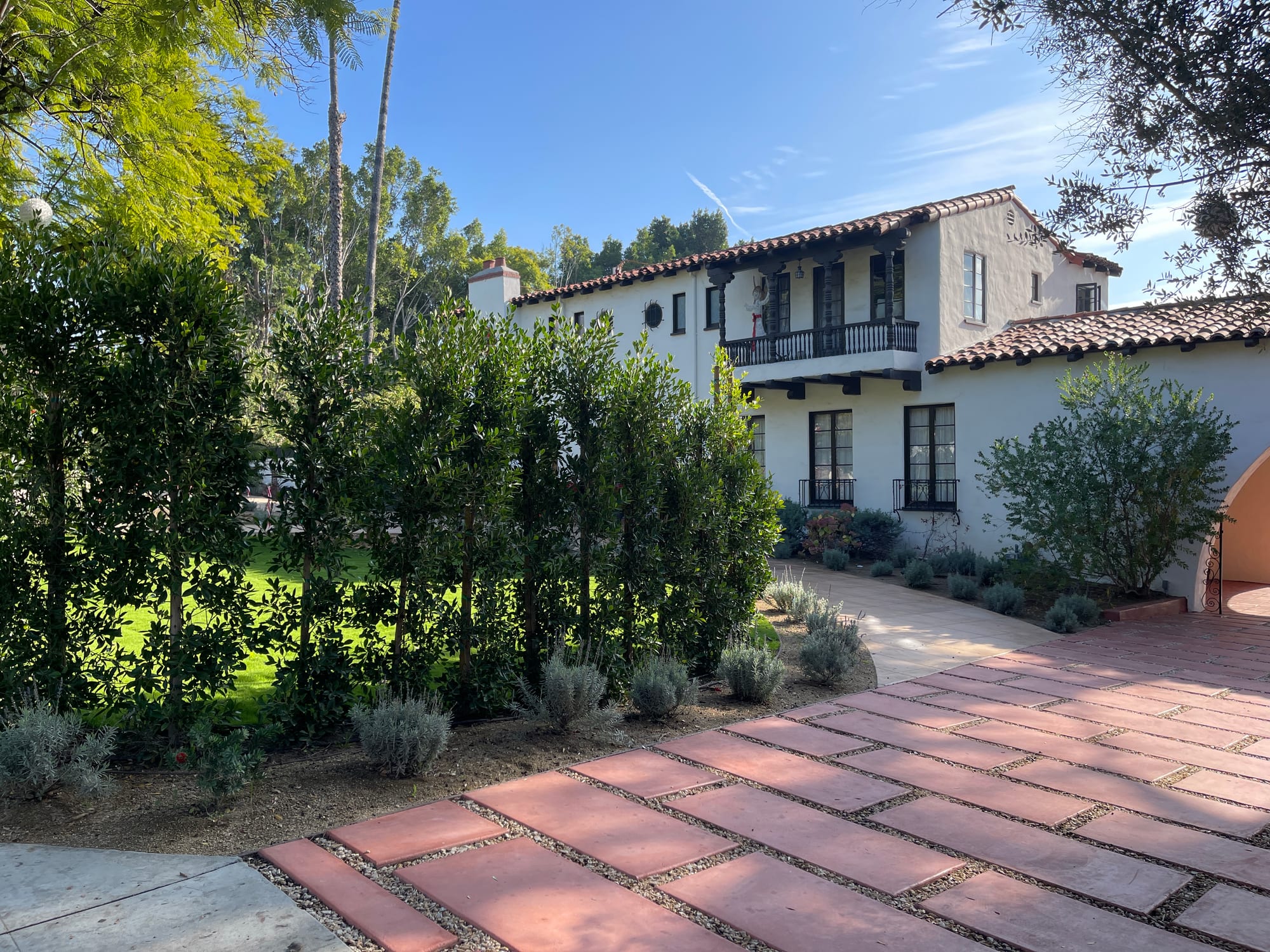 Brick-paved front courtyard beside the house