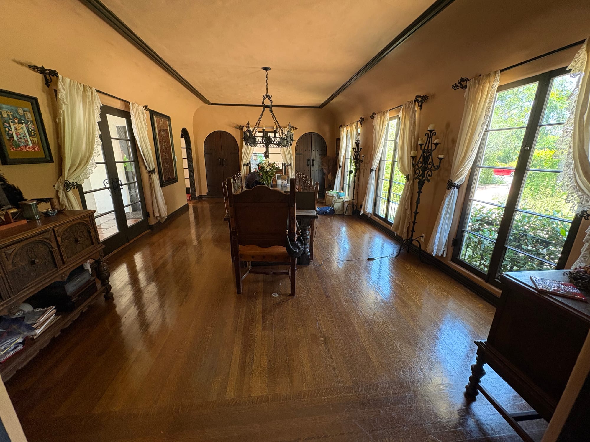 Formal room with hardwood floors and garden views