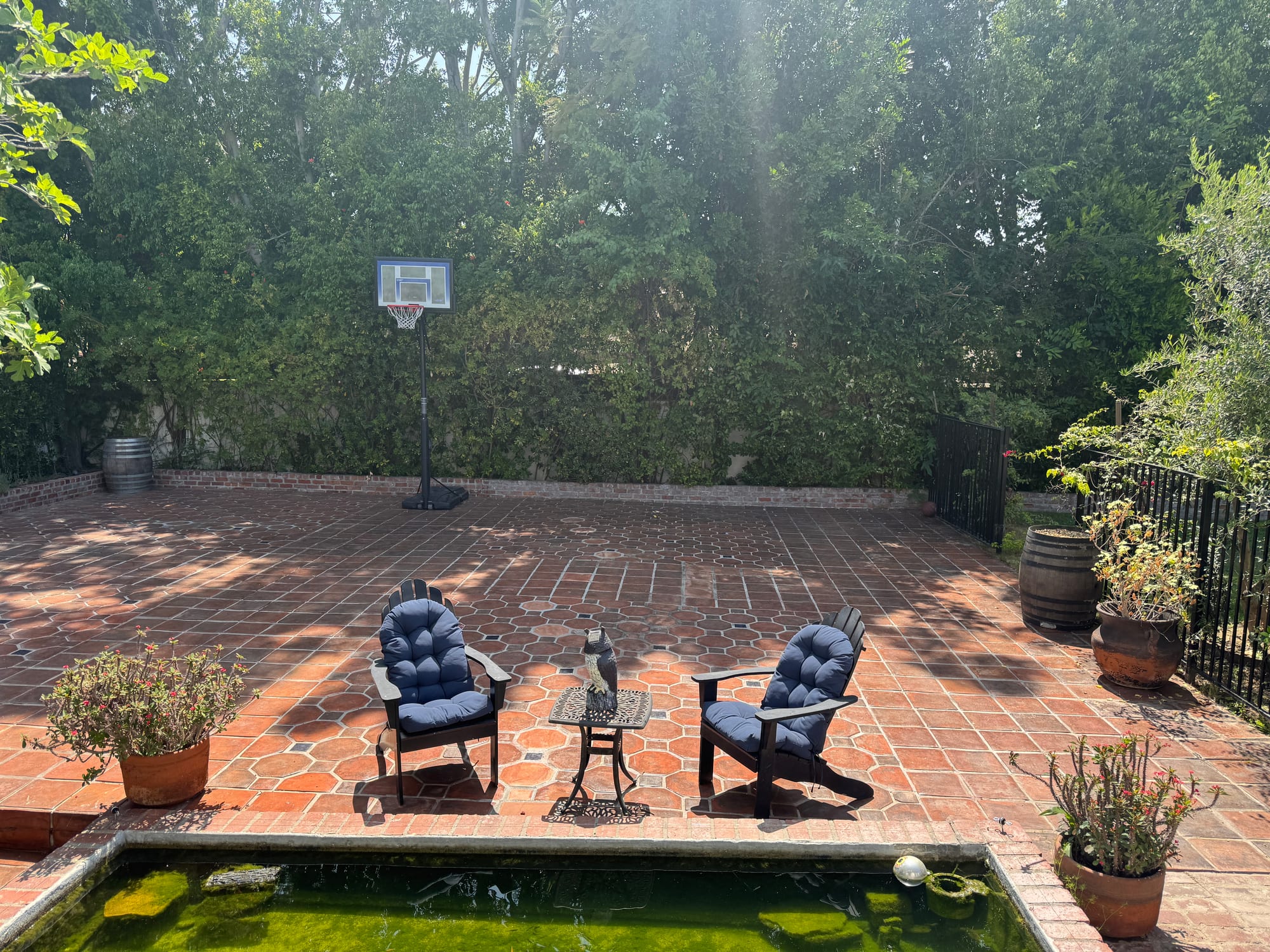 Brick patio courtyard with a reflecting pool